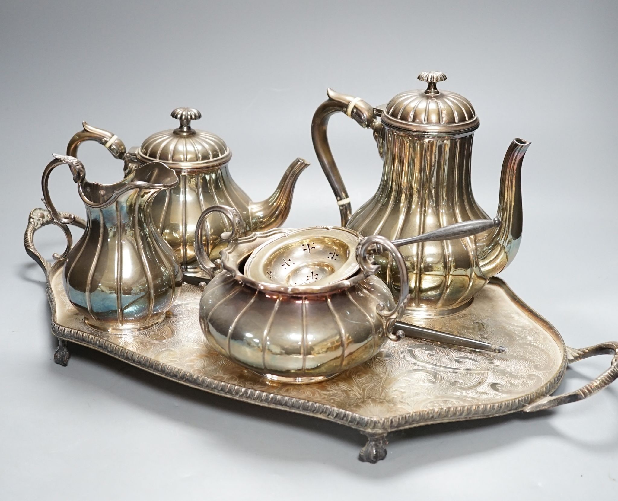 A four piece plated tea set and tray